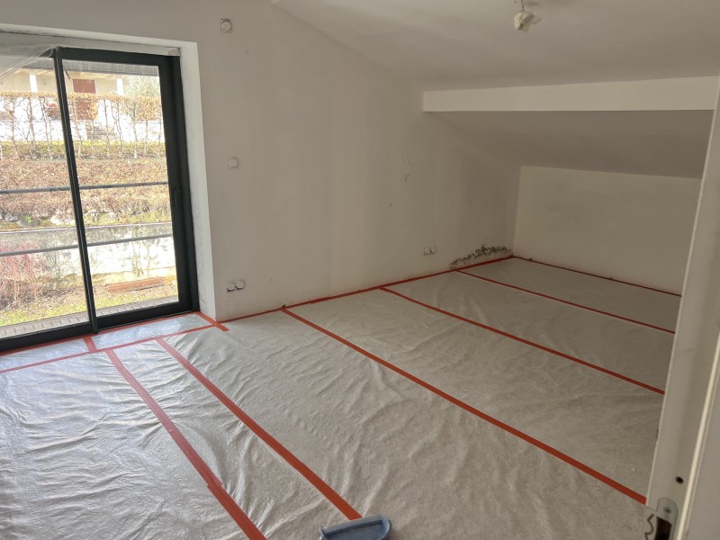 Pose de plaques BA13, cloisons Optima et laine de verre GR32 pour une isolation thermique performante à Limonest à coté de Lyon