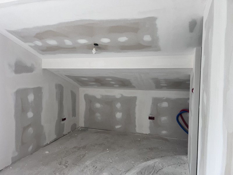 Pose de plaques BA13, cloisons Optima et laine de verre GR32 pour une isolation thermique performante à Limonest à coté de Lyon