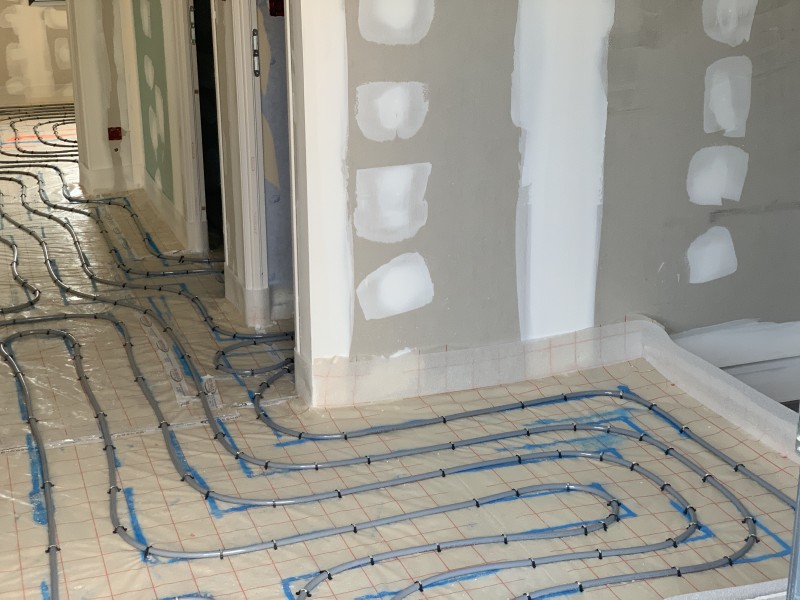 Installation d’un plancher chauffant sur 120 m² et d’une pompe à chaleur Daikin air/eau à Saint-Genis-Pouilly